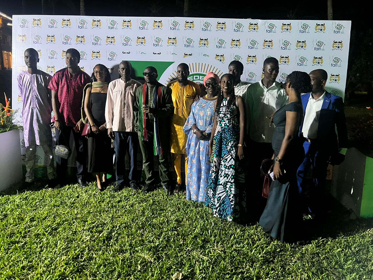 Executive team celebrating on stage with award plaque